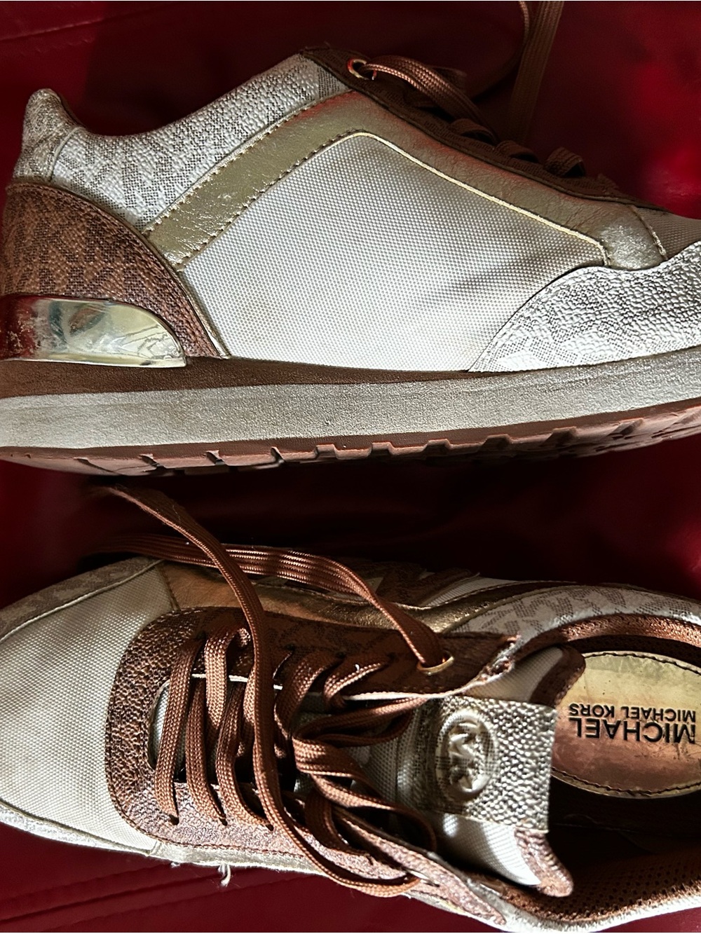 Michael Kors women’s White and Rose Gold Accent Sneakers